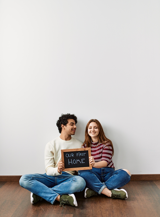 young couple in their new home purchased with the help of an Everton Park Mortgage Broker