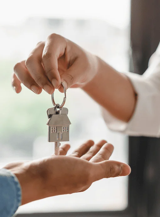 Wilston mortgage broker giving a homeowner the keys to their new home